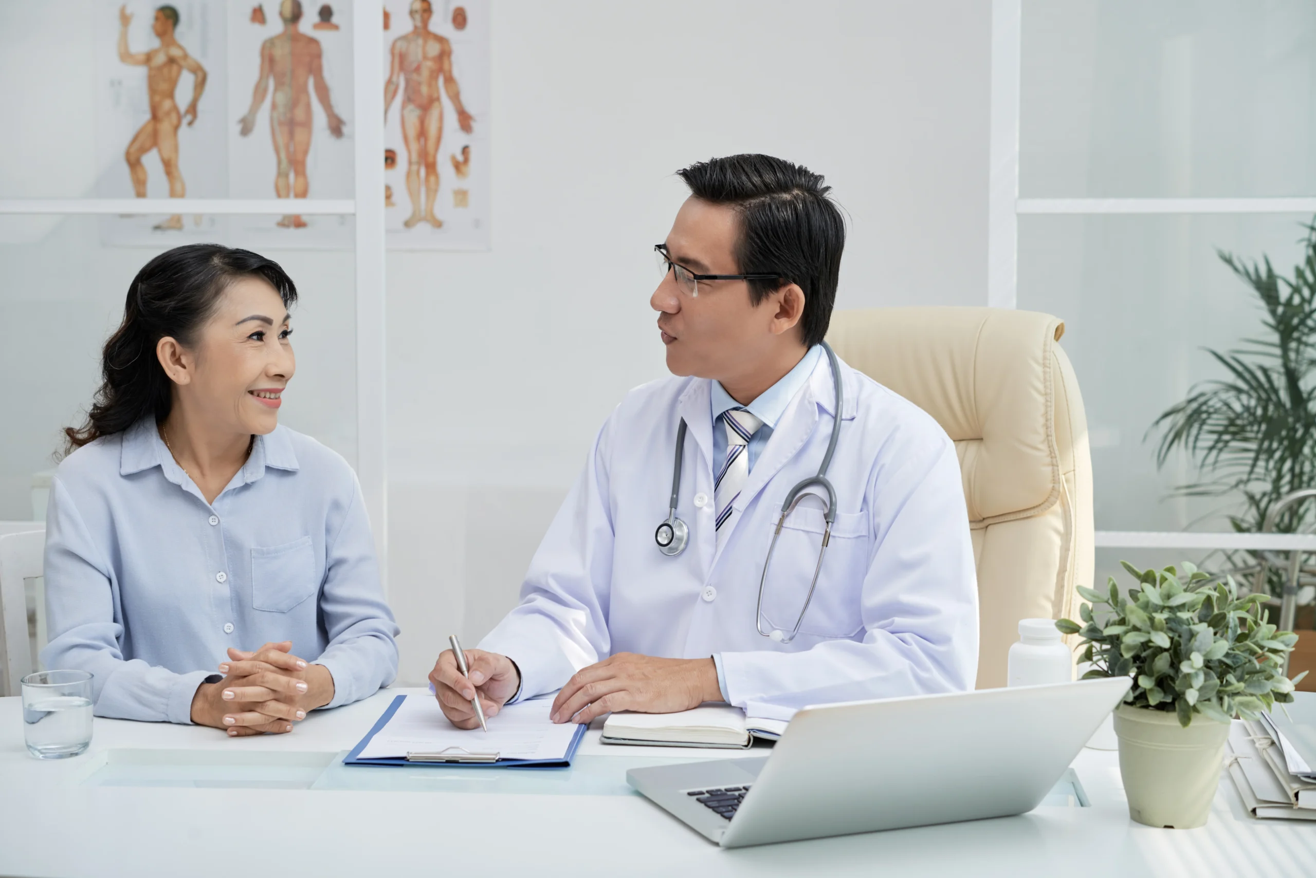 patient talking to doctor in consultation room